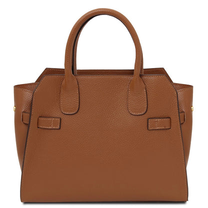 Brown leather handbag on a white background