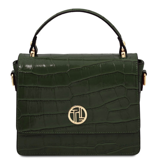 Green crocodile-patterned handbag with a gold logo on a white background