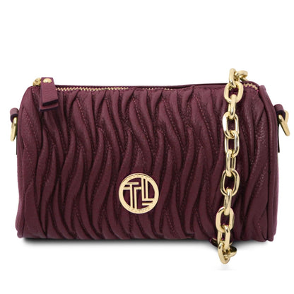 Purple handbag with gold chain and logo on a white background