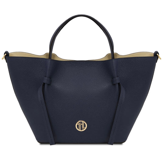 Navy blue handbag with a gold logo on a white background