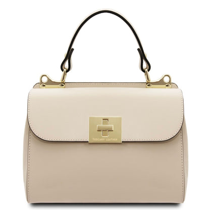 Beige handbag with gold accents on a white background